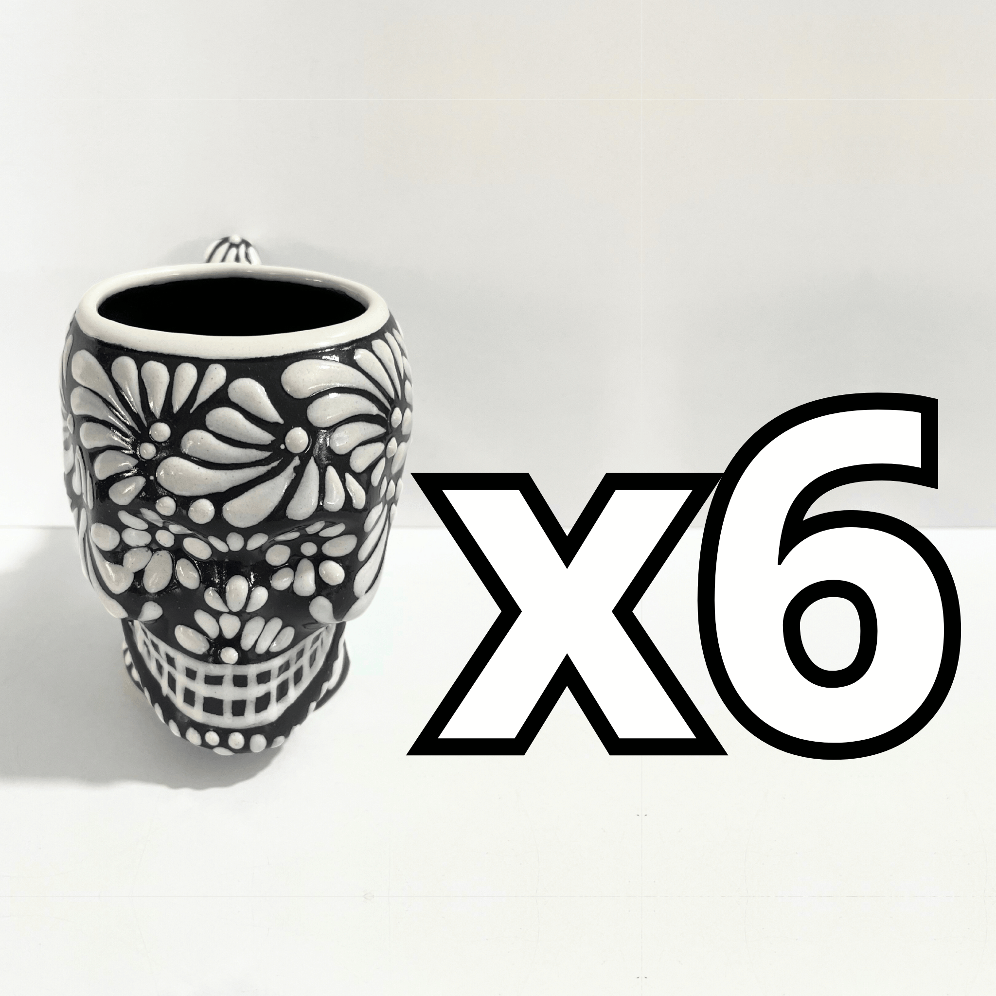 TAZA FORMA DE CRANEO FONDO NEGRO MIK BLANCO