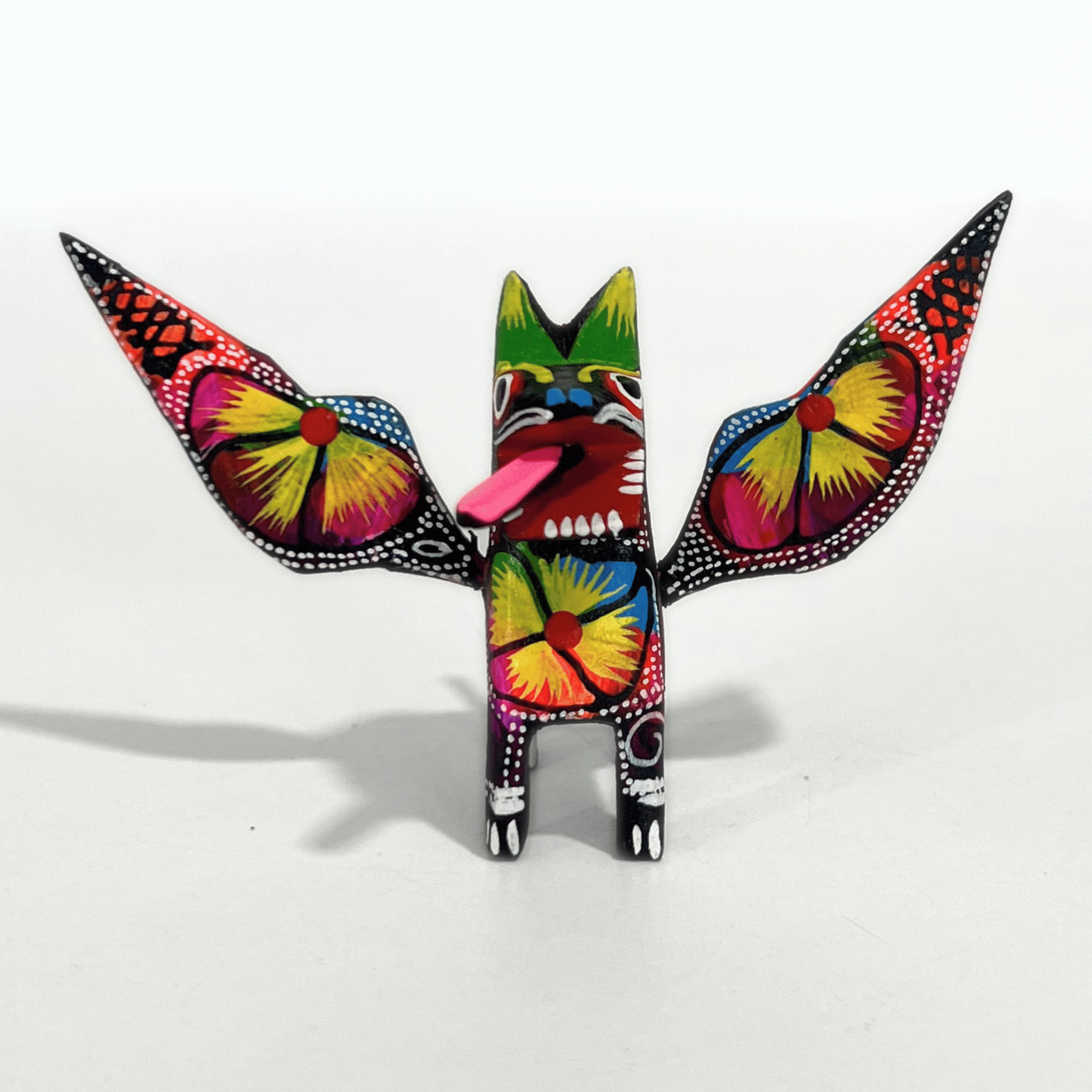 ALEBRIJE DE MADERA PERRO NEGRO FLORES MULTICOLOR