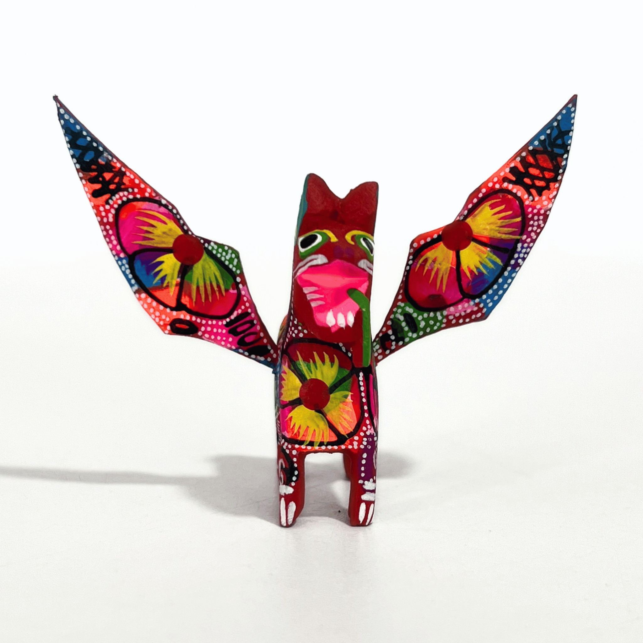 ALEBRIJE DE MADERA PERRO ROJO FLORES MULTICOLOR