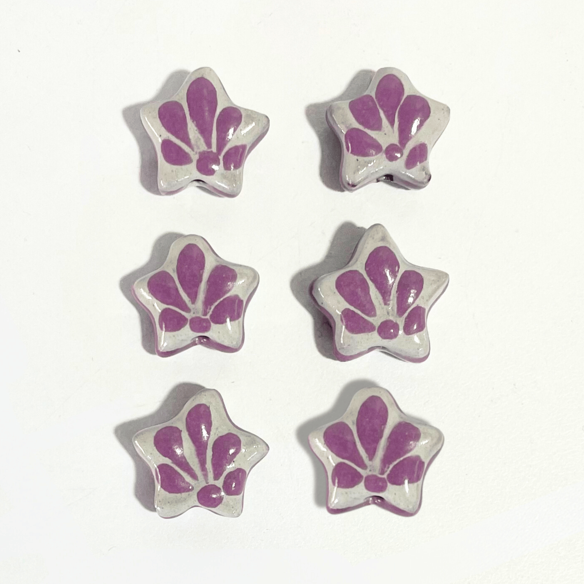 ESTRELLA 5 PICOS 1.7 CM FONDO TRADICIONAL DECORADO MORADO