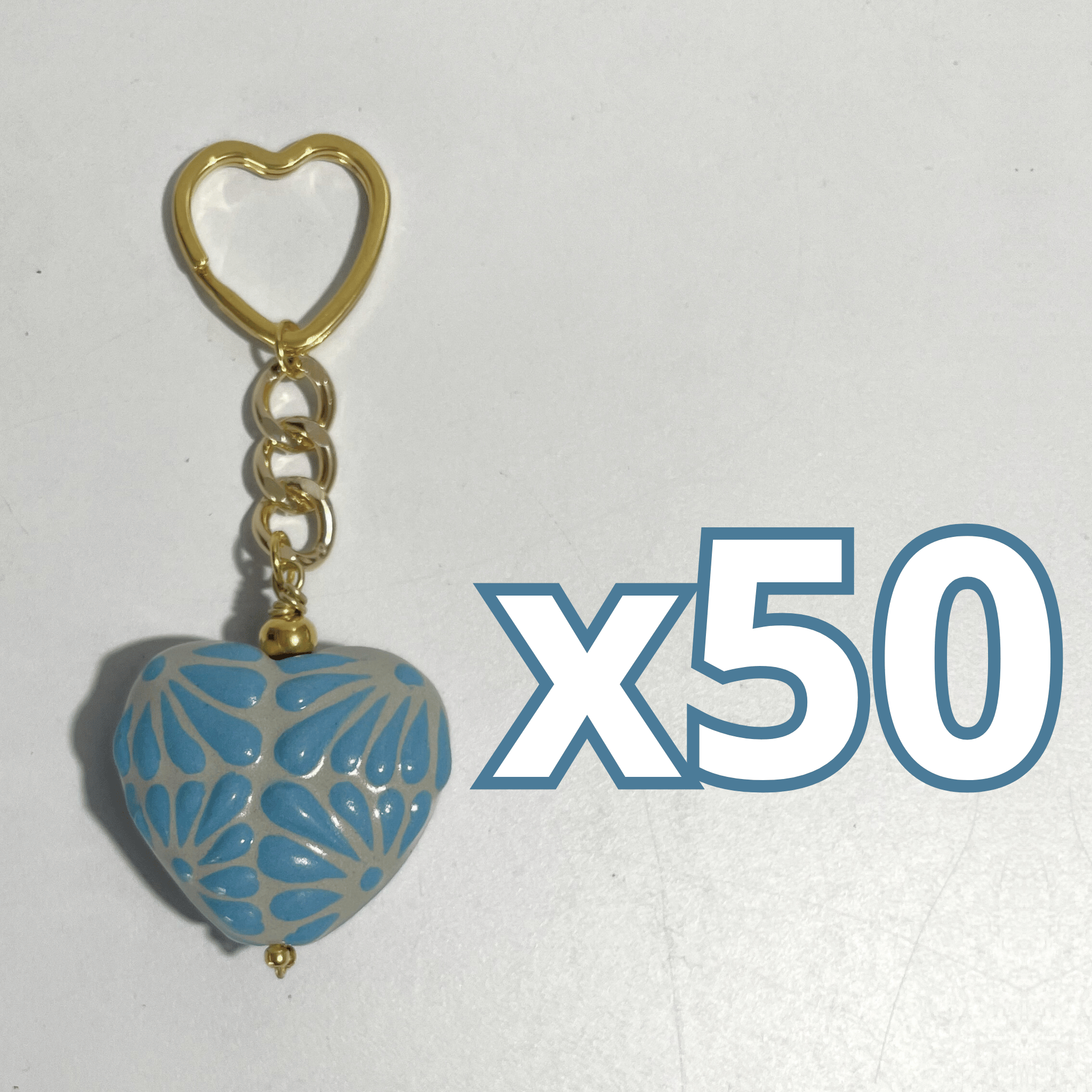 LLAVERO CORAZON INFLADO FONDO TRADICIONAL DECORADO AZUL PASTEL