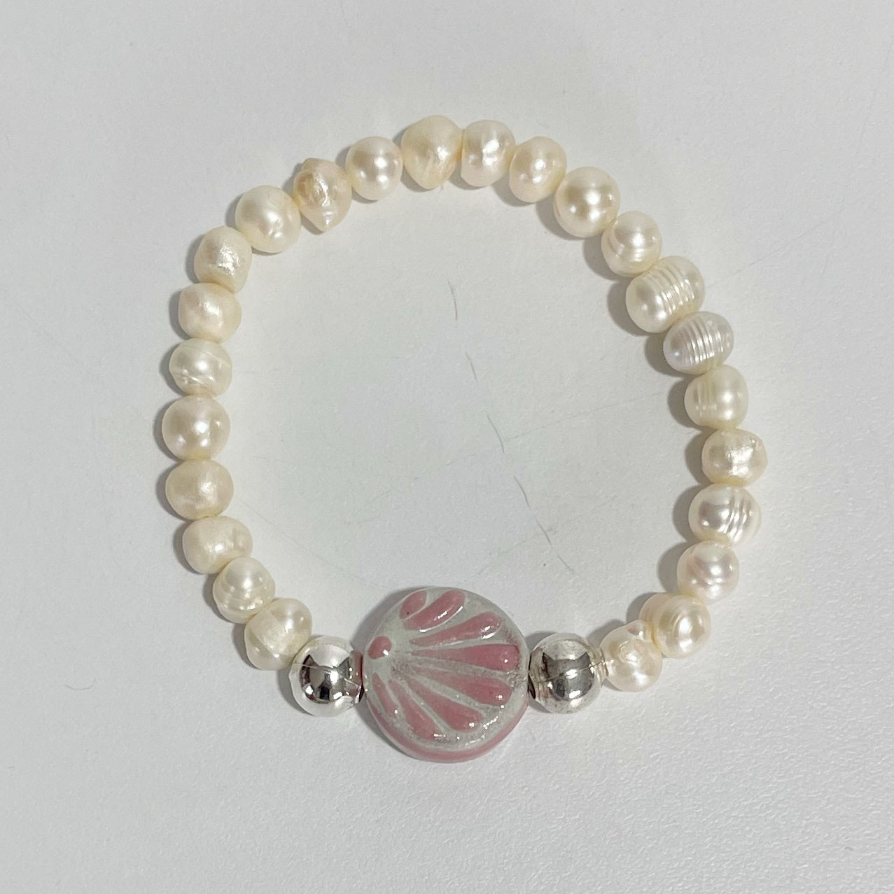 PULSERA CIRCULO FONDO BLANCO DECORADO ROSA
