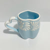 TAZA CORAZON CON ASA DE CORAZON FONDO BABY BLUE CENEFA MIK BLANCO